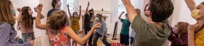 Acting teaching in room with enthusiastic students